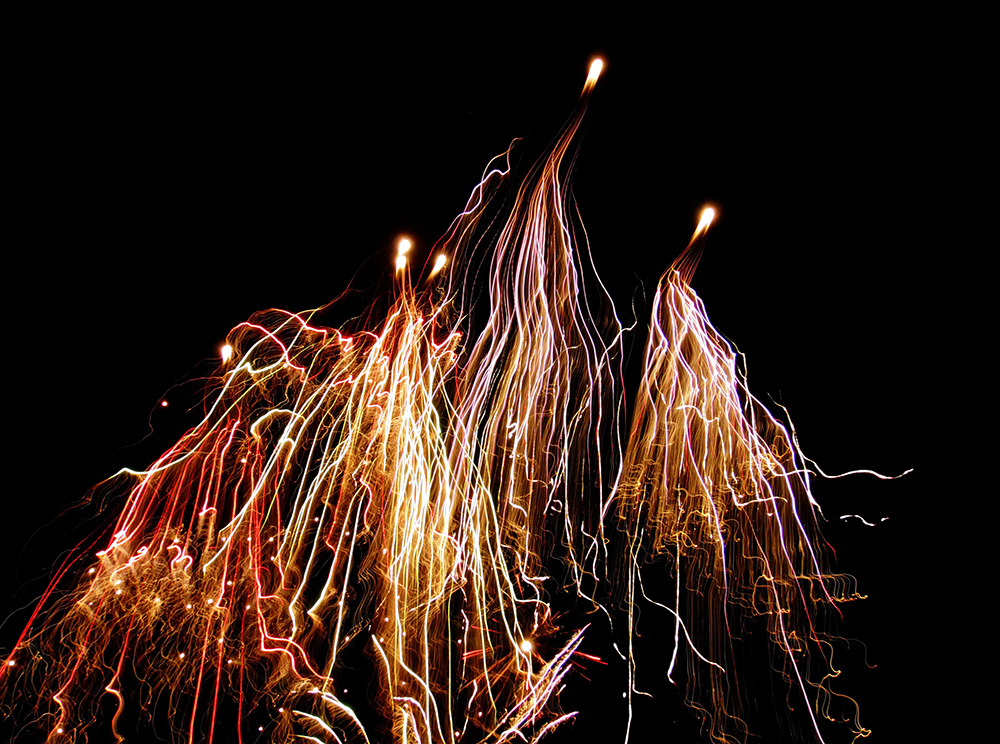 Long-exposure photography of New Year's fireworks.